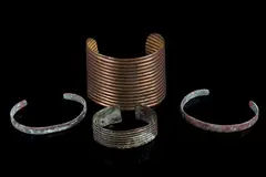 The lot features a collection of four original 19th to 20th Century Navajo Native American Indian copper and by Navajo Copper & Bronze Trade Bracelets, bronze trade bracelets. The bracelets include a large bronze bracelet with corru, offered Nov 2018