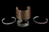 The lot features a collection of four original 19th to 20th Century Navajo Native American Indian copper and by Navajo Copper & Bronze Trade Bracelets, bronze trade bracelets. The bracelets include a large bronze bracelet with corru, offered Nov 2018