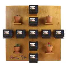 Japanese Garden by Nam June Paik, 1994, single-channel video installation including nine tv monitors and four potted plants mounted on plywood, sold May 2025