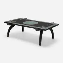 Coffee table by Ettore Zaccari, carved and lacquered wood, sold May 2025