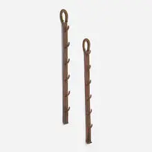 Jacques Adnet, Coat racks, pair, c. 1965, saddle-stitched leather over steel, brass