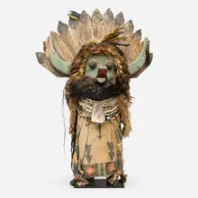 Zuni, Large Kachina doll, c. 1910, pine, cloth, fur, paint, yarn, assorted bird feathers, freshwater snail shells, turquoise nuggets, Olivella shells, cylindrical bone beads, spherical wood beads, abalone, spiny oyster, alabaster, coral, glass, horse hair, goat hair, cotton
