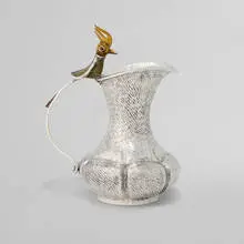 Pitcher with bird-of-paradise handle by Los Castillo, sold May 2025