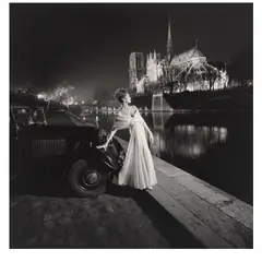 Gleb Derujinsky, Carmen Dell'Orefice in a a Gown by Griffe (Notre-Dame Cathedral and the Seine at Night), 1957, Gelatin silver print