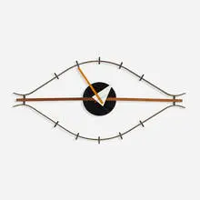 Eye wall clock, model 2238 by George Nelson & Associates, 1952, walnut, lacquered wood, brass, enameled steel, enameled aluminum, sold Feb 2016