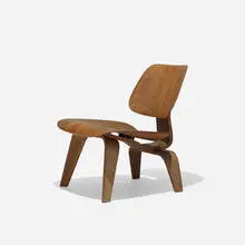 pre-production LCW by Charles and Ray Eames, 1945, walnut plywood, rubber, steel, sold Feb 2016