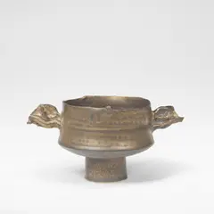 Colin Pearson, Small stem bowl with wings, Porcelain, golden bronze glaze, mounted with two double combed wings