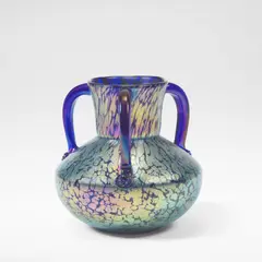 Loetz, 'Papillon' three-handled vase, circa 1930, Blown glass with speckled iridescence, of squat form with three handles rising to a slightly flared rim