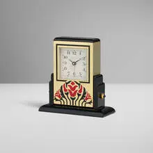 Claude Moliterni, Les Must de Cartier Basculante desk clock, c. 1990, gilt metal, lacquer, blue sapphire cabochon