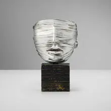 Veiled Face by Igor Mitoraj, 1977, silver-plated bronze, painted wood, sold Apr 2025