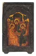 Icon of the Old Testament Trinity, Greek, 18th century, traditionally painted in sombre colours, the three angels seated at a table before the House of Abraham, in a landscape, in foliate wooden frames
