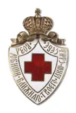 maker's mark in Cyrillic rubbed by Imperial Russian Silver and Enamel Red Cross Badge, translucent guilloché enamel on white ground centred with a red cross with Cyrillic inscription Love your neighbour as y, offered Sep 2025