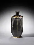 Shigeyoshis Ichino, A cut-sided Vase (restored chips to rim), stoneware, layered tenmoku over iron glazes