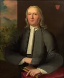 English School, Portrait of a gentleman of the Monins family, probably the Rev. Richard Eaton Monins, half-length, in a grey coat, holding a book, oil on canvas