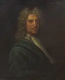 English School, Portrait of John Jervis of Darleston, bust-length, in a blue jacket, within a painted oval; and Portait of his wife, Mary Jervis, bust-length, in a white dress, in a painted oval circa 1720, in a carved frame, oil on canvas