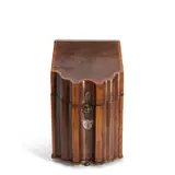 England, 19th century, by Georgian Inlaid Mahogany Tantalus, knife box shape with hinged slant top opening to reveal four compartments fitted with glass decanters and stoppers,  ht, sold Oct 2025