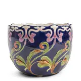 second half 19th century, by Continental Majolica Plant Pot, polychrome enameled and raised scrolled foliate decoration to a deep blue ground,  ht, sold Jul 2025