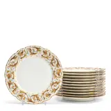 early 20th century, by Twelve French Porcelain Plates, New York, scalloped rims with raised gold arabesque foliate decoration enhanced with enameled sprigs,  dia, sold Jul 2025