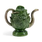 Continental, 19th century, by Majolica Cabbage-form Teapot and Cover, naturalistically modeled and decorated in a green glaze, snake-like handle and spout,   ht, sold Mar 2025