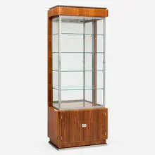 Vitrine by Jules Leleu, c. 1935, African walnut, glass, mirrored glass, nickel-plated metal, sold Feb 2025