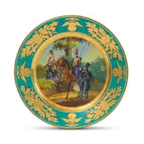 Circular, the centre painted with officers of the 5th Infantry Corps and 5th Light Cavalry, within a gilt cavetto and green border with gilt ciselé Imperial eagles and military trophies, inscribed in Russian "5th Infantry Corps. 5th Light Cavalry: Division A Private of the Bugsky Uhlan regiment. Staff Officer of the Odessa Uhlan regiment Private of the Akhtirsky Hussar regiment. Chief Officer of the Aleksandysky Hussar regiment.", and marked, dated and signed "P. Soloviev" in Cyrillic under base by Assiette militaire, Manufacture impériale de porcelaine, St Petersbourg, période Nicolas Ier en porcelaine A military plate, Imperial Porcelain Factory, St Petersburg, period of Nicholas I, offered Apr 2025