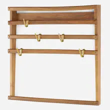 Carl Auböck, Wall-mounted rack, 1953, walnut, brass
