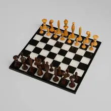Arthur Elliott, Universum Space Age chess set, 1958, maple, walnut, brass
