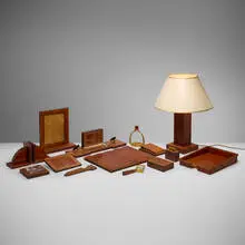 Paul Dupré-Lafon, Rare fourteen-piece desk set with table lamp, c. 1945, crocodile leather, wood, brass, glass, plastic, paper shade
