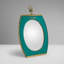 Rolex, Retailer's display mirror, c. 1965, gilt brass, lacquered metal, mirrored glass