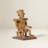Irving Harper, Untitled (Seated Figure), paper construction on painted wood base