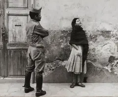 Leon Levinstein, Untitled, Mexico [woman and man in uniform], 1958, Gelatin silver print; signed 'Leon Levinstein' on the photographer's label affixed to the backing