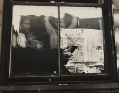 Leon Levinstein, East Harlem [family at window], c. 1952, Gelatin silver print; signed 'Leon Levinstein' on the photographer's label affixed to the backing and with the photographer's stamp on the backing