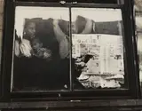 Leon Levinstein, East Harlem [family at window], c. 1952, Gelatin silver print; signed 'Leon Levinstein' on the photographer's label affixed to the backing and with the photographer's stamp on the backing