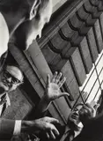 Leon Levinstein, Untitled, New York [street scene, men with hands raised], 1970-85, Gelatin silver print; Leon Levinstein label affixed to the backing