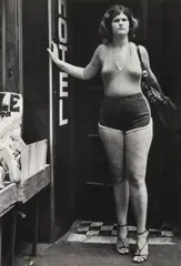 Leon Levinstein, NYC [woman in hotel entry], c. 1970, Gelatin silver print; Leon Levinstein stamp in ink on the verso