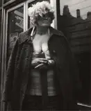 Leon Levinstein, NYC [woman with overcoat], c. 1970, Gelatin silver print; Leon Levinstein stamp in ink on the verso