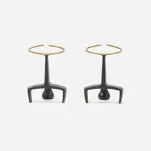 Andirons, pair by Donald Deskey, c. 1950, brass, enameled iron, sold Mar 2022