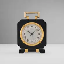 Claude Moliterni, Desk clock, c. 1990, lacquered and gilt metal, glass, synthetic sapphire cabochon