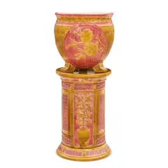 Wedgwood Majolica Jardiniere and Pedestal, Untitled, 1861, in the Magnolia pattern glazed in a deep pink and a burnt yellow, impressed mark,  jardiniere ht