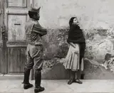 Leon Levinstein, Untitled, Mexico [woman and man in uniform], 1958, Gelatin silver print; signed 'Leon Levinstein' on the photographer's label affixed to the backing