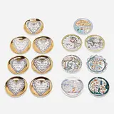 Collection of fourteen Antichi Planisferi and Love coasters by Piero Fornasetti, c. 1965, transfer-printed, glazed, and gilt porcelain, sold Mar 2022