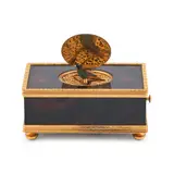 Swiss Singing Bird Automaton Box, rectangular and brass mounted, the lid lifts to reveal a chirping bird, manufactured by Reuge Music,  ht. 2, wd. 4 1/2, dp. 2 3/4 in., rectangular and brass mounted, the lid lifts to reveal a chirping bird, manufactured by Reuge Music,  ht
