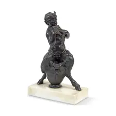 F. W. Pomeroy, patinated bronze of a satyr playing pan pipes, patinated bronze