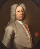 Portrait of Philip Musard, bust-length, in a grey coat, within a painted oval; and Portrait of Constance Musard, bust-length, in red, within a painted oval by English School, a pair, oil on canvas, sold Jul 2024