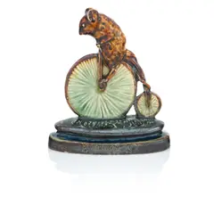 George Tinworth, for Doulton Lambeth, circa 1882, 'Bicyclist': A glazed stoneware model of a mouse on a penny farthing bicycle, circa 1882