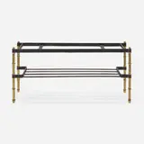 attribution Jacques Adnet, Coffee table, c. 1955, saddle-stitched leather over steel, brass, brass-plated steel, glass