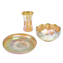Three Table Objects by Tiffany Studios, Favrile glass, comprising threaded vase, shallow dimpled bowl, and ruffled finger bowl, each inscribed 'L, sold Mar 2024