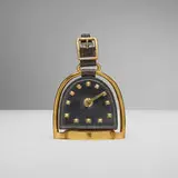 Jacques Adnet, Stirrup travel clock, c. 1950, leather, brass-plated steel, brass