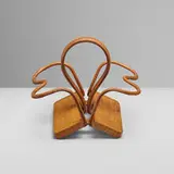 Jacques Adnet, Bottle holder, c. 1950, saddle-stitched leather over steel, oak
