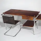 Karl Otto, Schreibtisch mit MR 10 Stahlrohrstuhl. 1930 und 1927, Rio Palisander, poliert; Stahlrohr, verchromt / Stahlrohr, verchromt; Korbgeflecht, gebeizt (Ausführung Schlosserei Berliner Metallgewerbe Joseph Müller)